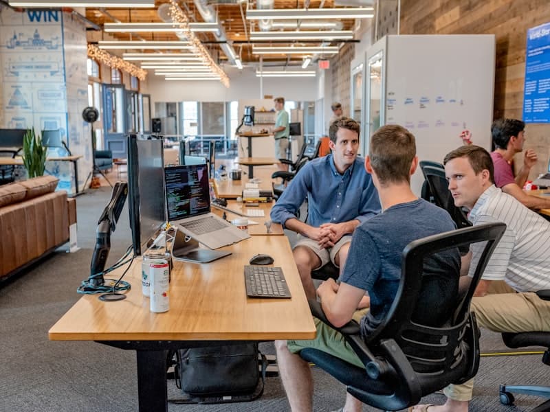 Professional advisors meeting with a business owner